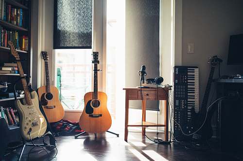 leisure activities several guitars beside of side table guitar